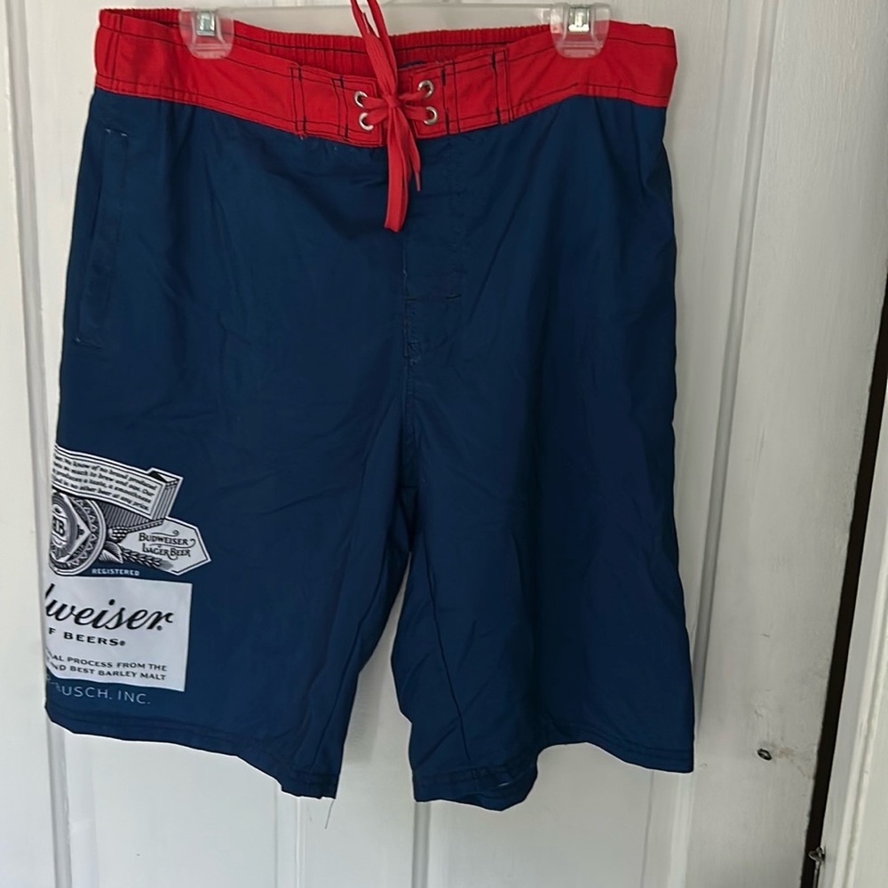 Budweiser bathing suit in navy blue with red waistband. 2 pockets. Drawstring.